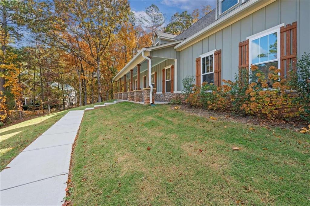 51 Post Oak Trace Villa Rica, GA 30180 - Photo 5 of 54 a view of a brick house with a yard