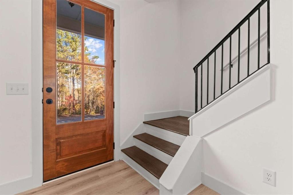 51 Post Oak Trace Villa Rica, GA 30180 - Photo 8 of 54 a view of an entryway with wooden floor and door
