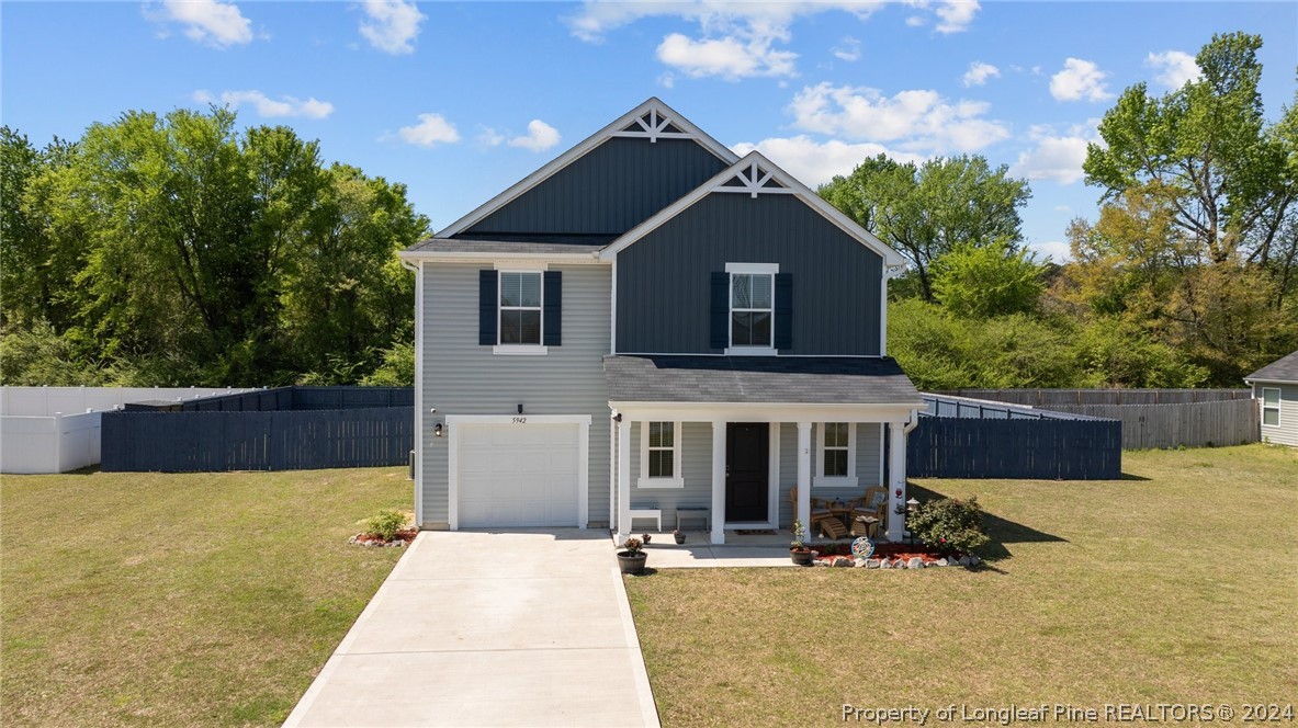 5942 Lowgrass Road Stedman, NC 28391 - Photo 1 of 28 a front view of a house with yard