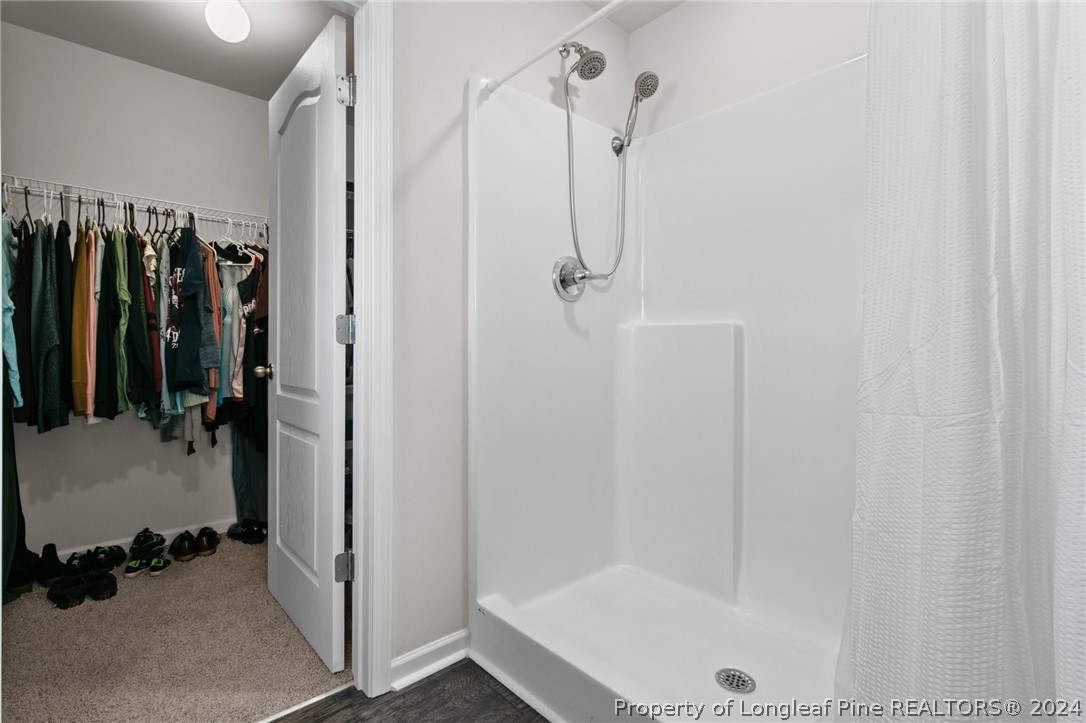 5942 Lowgrass Road Stedman, NC 28391 - Photo 14 of 28 a bathroom with a shower