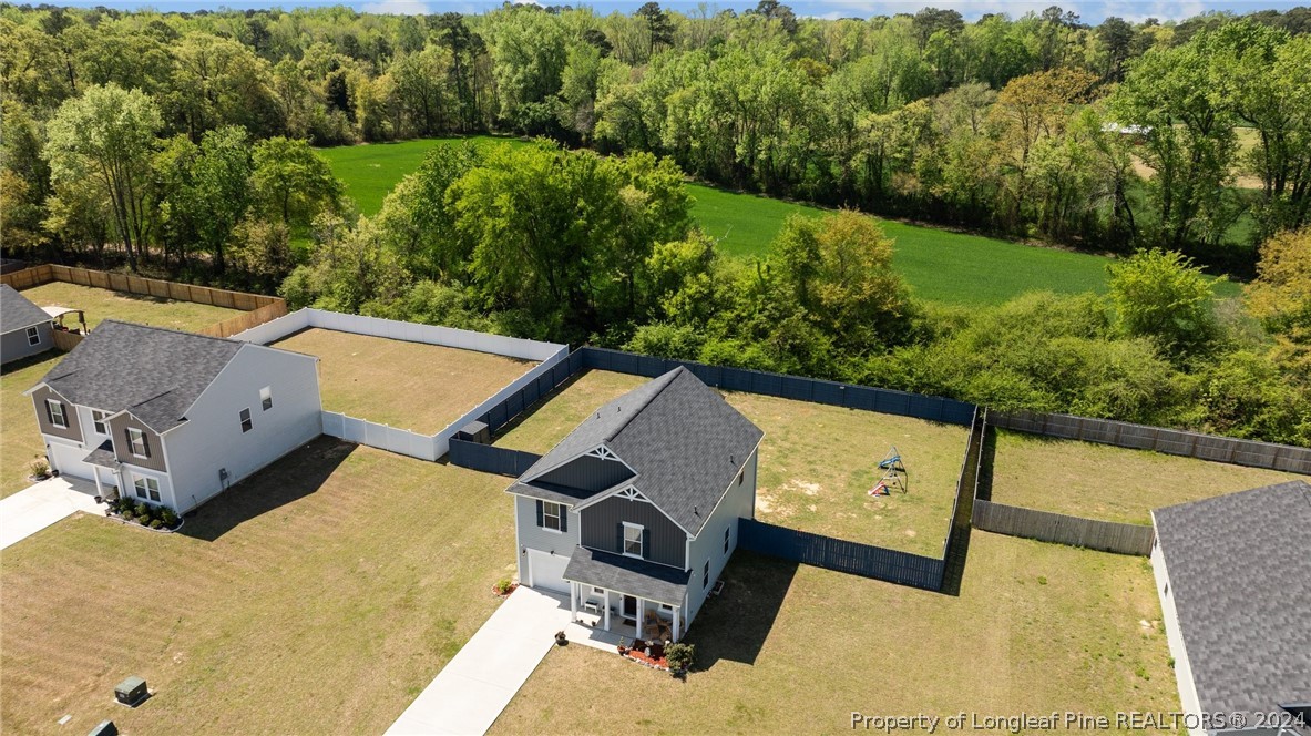 5942 Lowgrass Road Stedman, NC 28391 - Photo 2 of 28 an aerial view of a house having yard