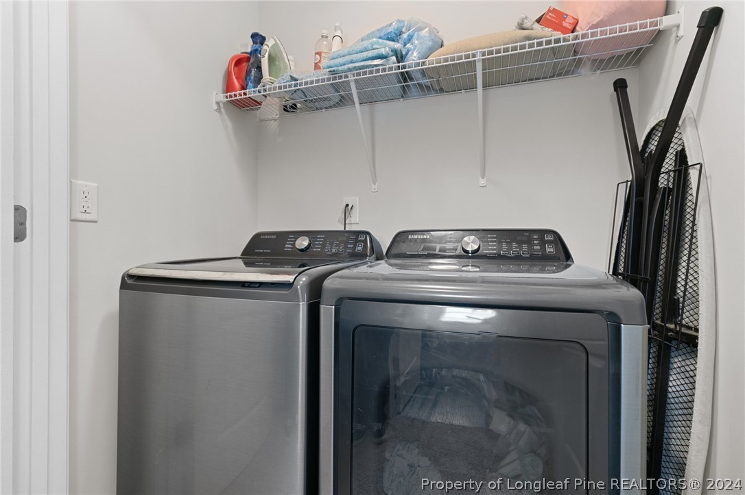 5942 Lowgrass Road Stedman, NC 28391 - Photo 24 of 28 a utility room with dryer and washer
