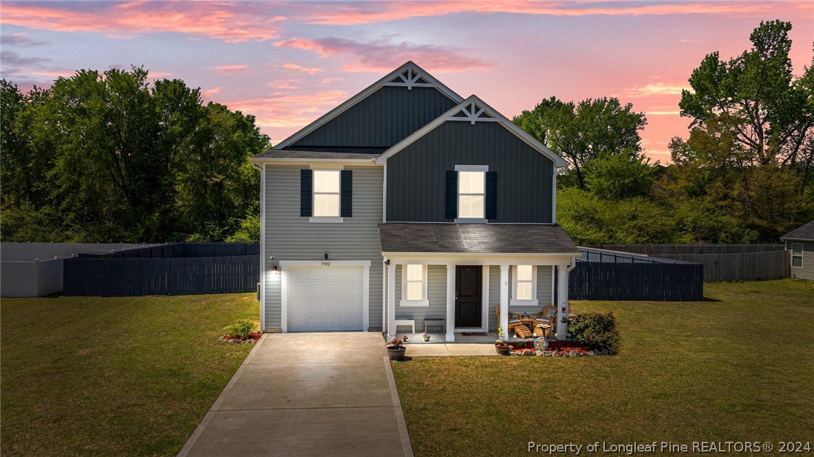 5942 Lowgrass Road Stedman, NC 28391 - Photo 28 of 28 a front view of a house with yard and parking