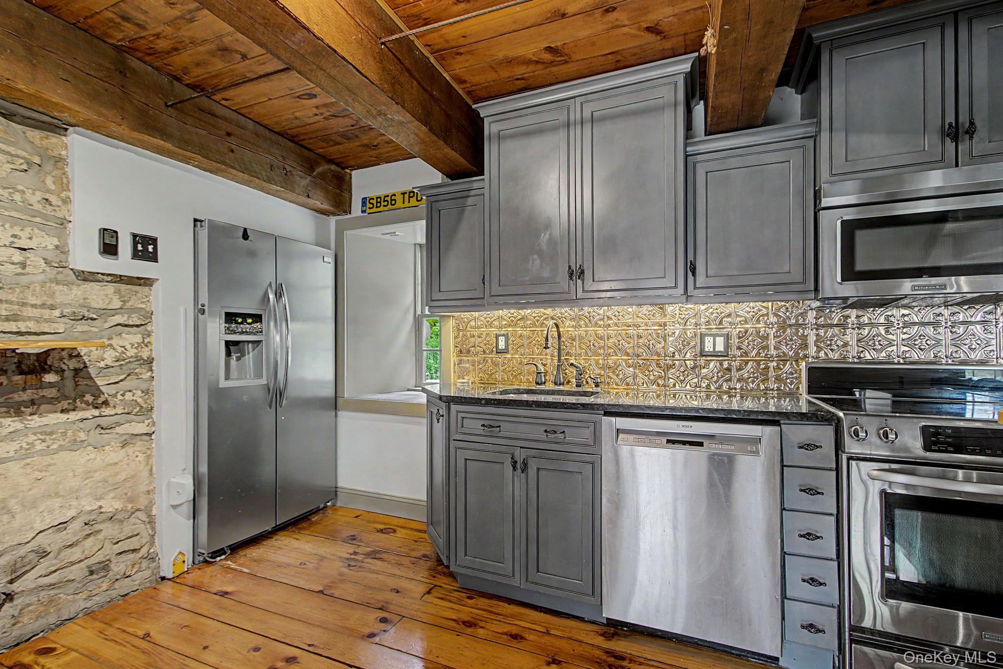 168 Old Rte 55 Pawling, NY 12564 - Photo 8 of 43 a kitchen with stainless steel appliances granite countertop a refrigerator and a stove top oven