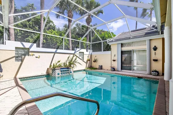 a view of a swimming pool with a patio