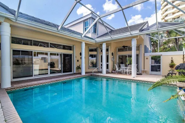 front view of a house with a swimming pool
