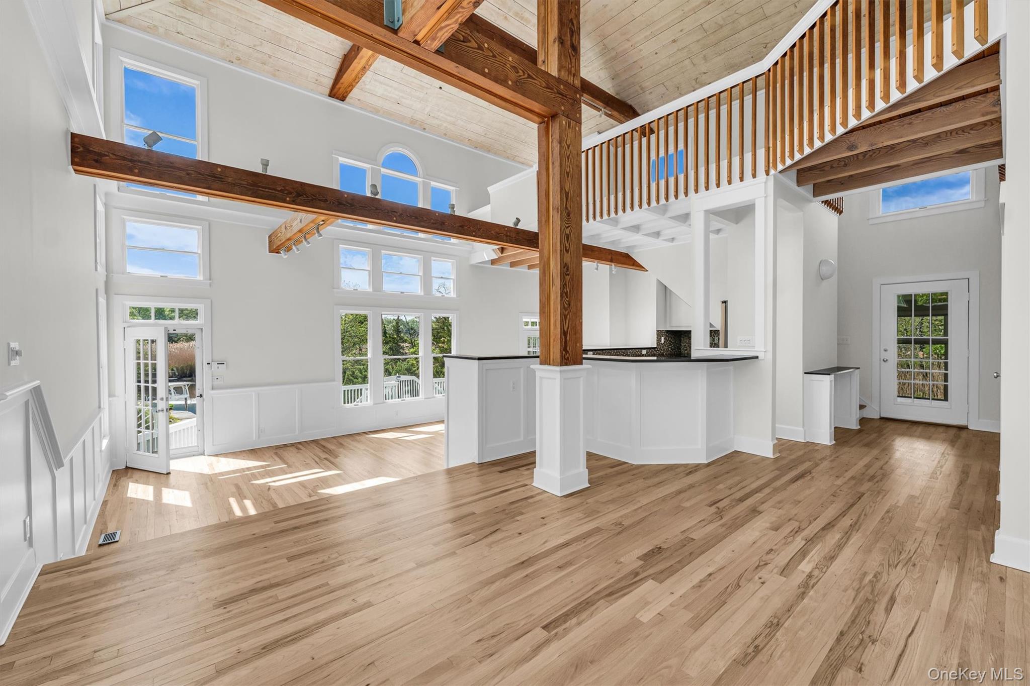 238 Beaver Dam Road Brookhaven, NY 11719 - Photo 9 of 44 a view of empty room with wooden floor and windows