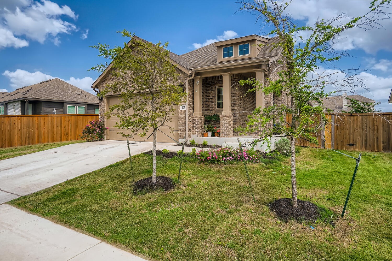 231 Spinnaker Loop Kyle, TX 78640 - Photo 2 of 24 a backyard of a house with table and chairs