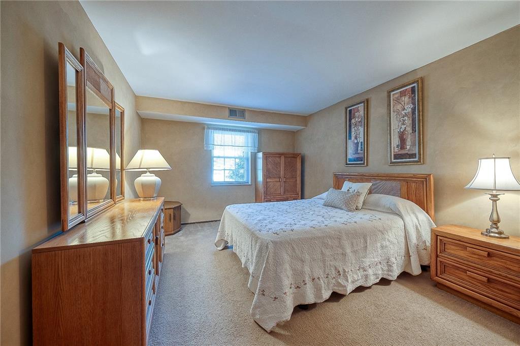 551 Sloop Road, Unit 53 Pittsburgh, PA 15237 - Photo 13 of 21 a bedroom with a bed and window with chair