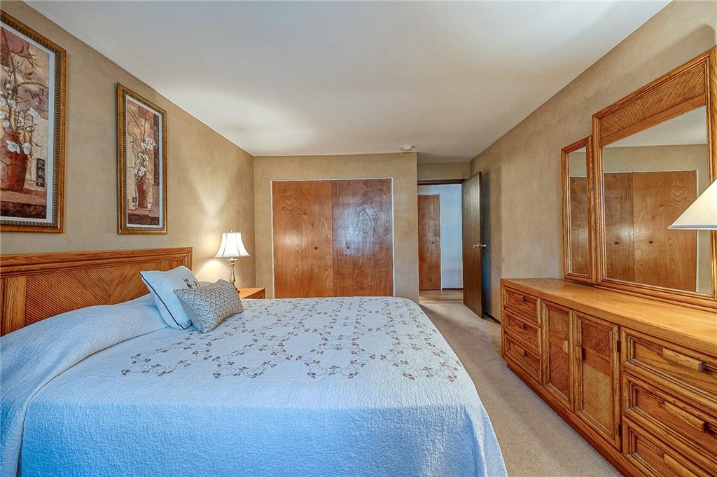 551 Sloop Road, Unit 53 Pittsburgh, PA 15237 - Photo 14 of 21 a spacious bedroom with a large bed and a dresser