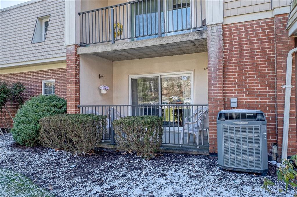 551 Sloop Road, Unit 53 Pittsburgh, PA 15237 - Photo 19 of 21 a view of front door of house with plants and wooden fence