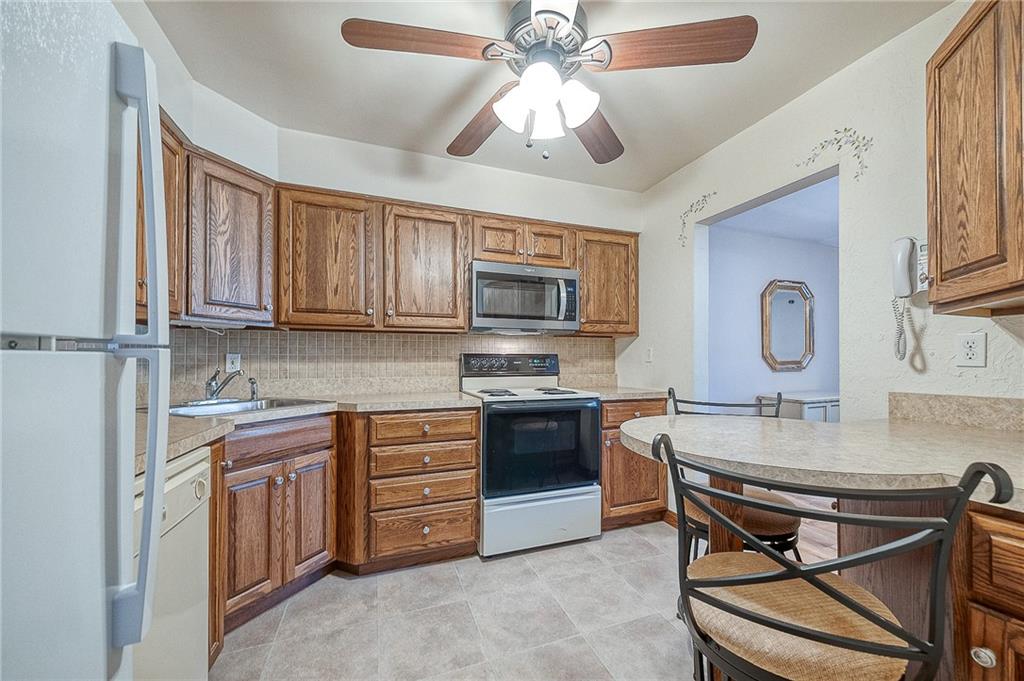 551 Sloop Road, Unit 53 Pittsburgh, PA 15237 - Photo 8 of 21 a kitchen with stainless steel appliances granite countertop a stove and cabinets