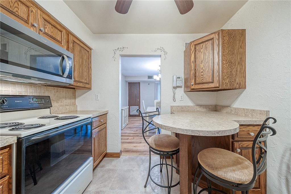551 Sloop Road, Unit 53 Pittsburgh, PA 15237 - Photo 10 of 21 a kitchen with a stove and a fireplace
