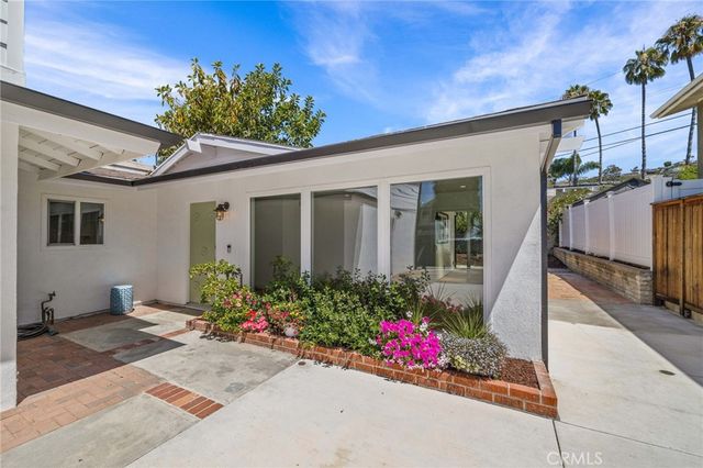 a kitchen with stainless steel appliances a refrigerator and a sink