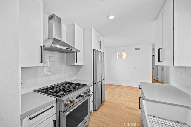 a spacious bathroom with a double vanity sink and mirror