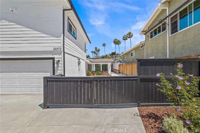 a view of a hallway with washer and dryer