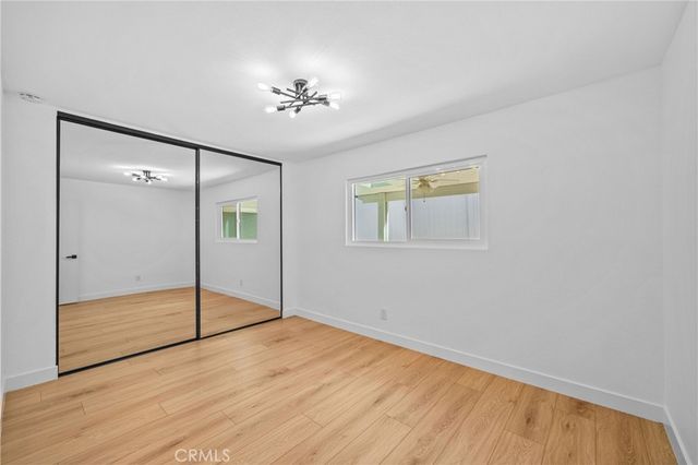 an aerial view of a building with streets and trees