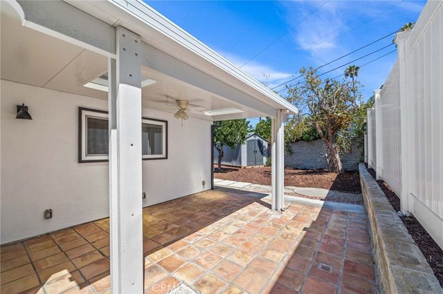 an aerial view of residential houses with city view