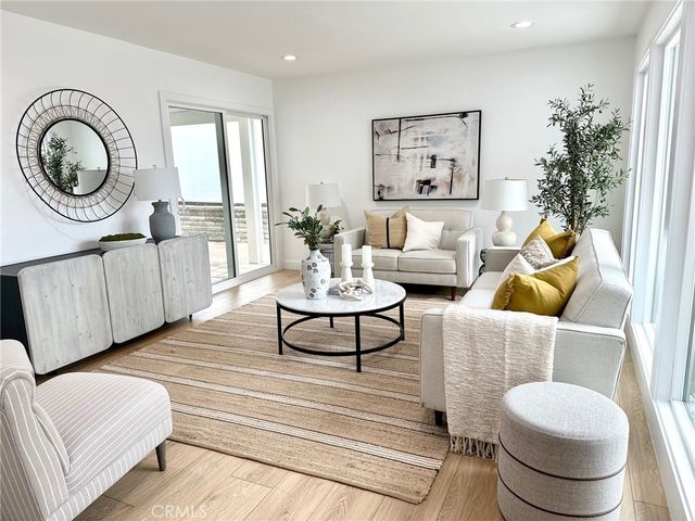 a view of a workspace with furniture and a potted plant