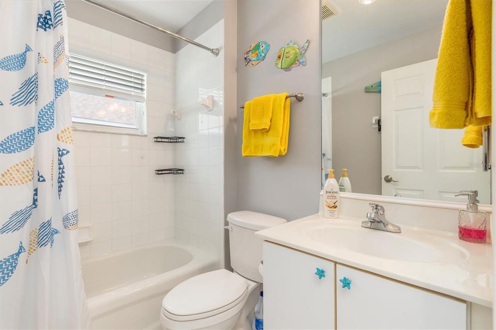 24167 Buckingham Way Punta Gorda, FL 33980 - Photo 16 of 42 a bathroom with a sink toilet and shower