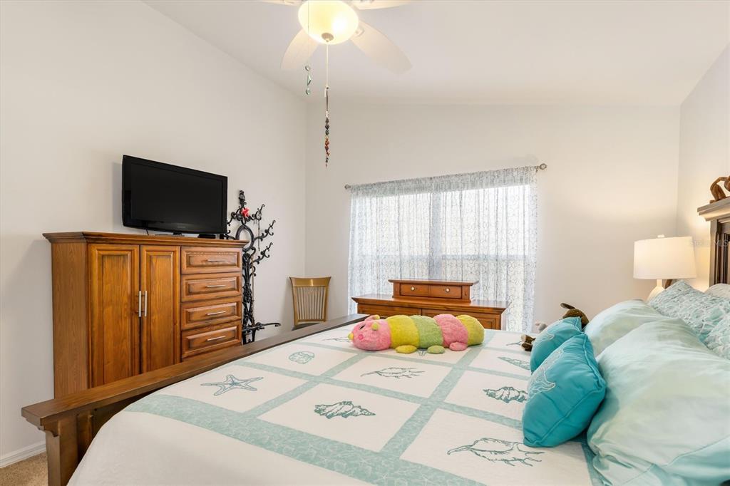 24167 Buckingham Way Punta Gorda, FL 33980 - Photo 20 of 42 a bedroom with a bed and a television