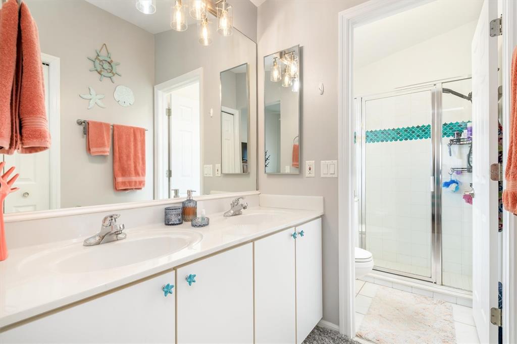 24167 Buckingham Way Punta Gorda, FL 33980 - Photo 21 of 42 a bathroom with a sink and a mirror