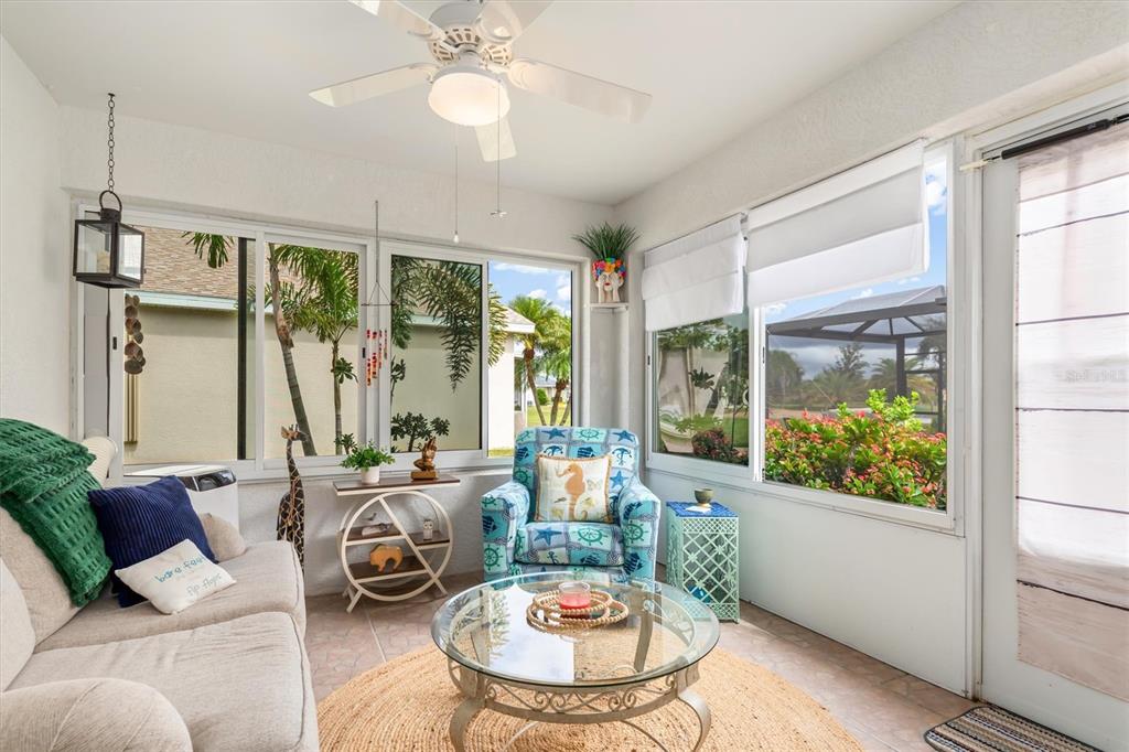 24167 Buckingham Way Punta Gorda, FL 33980 - Photo 23 of 42 a living room with furniture and a large window