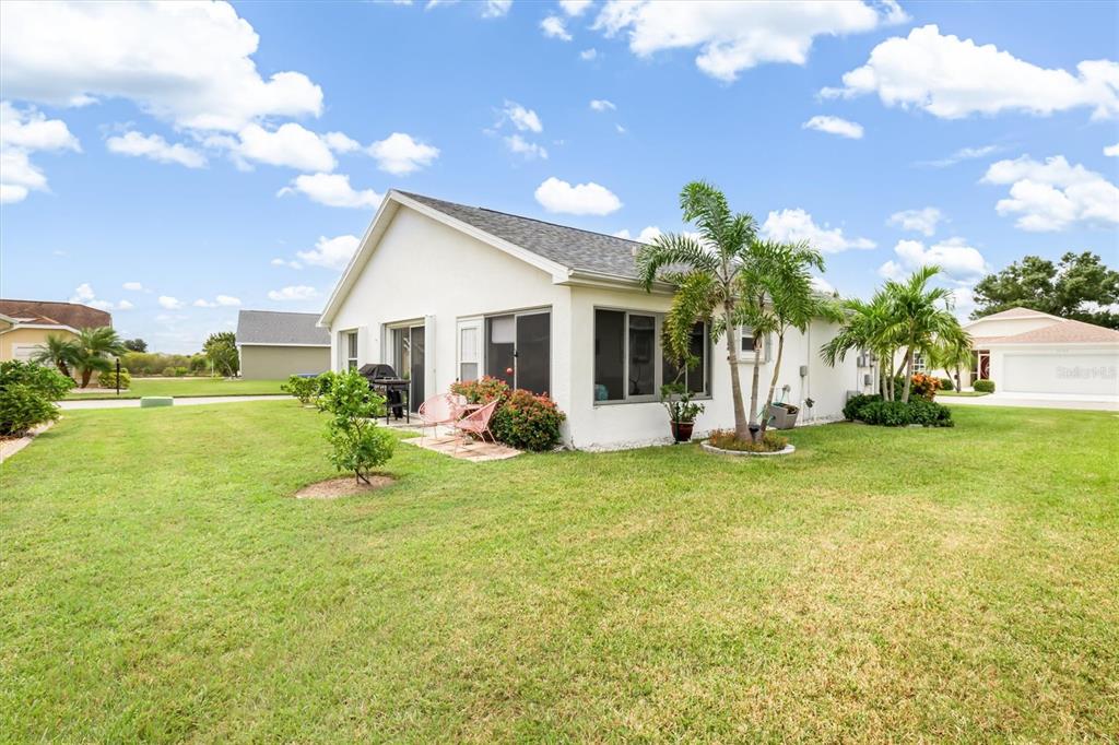 24167 Buckingham Way Punta Gorda, FL 33980 - Photo 25 of 42 a view of a house with backyard and sitting area