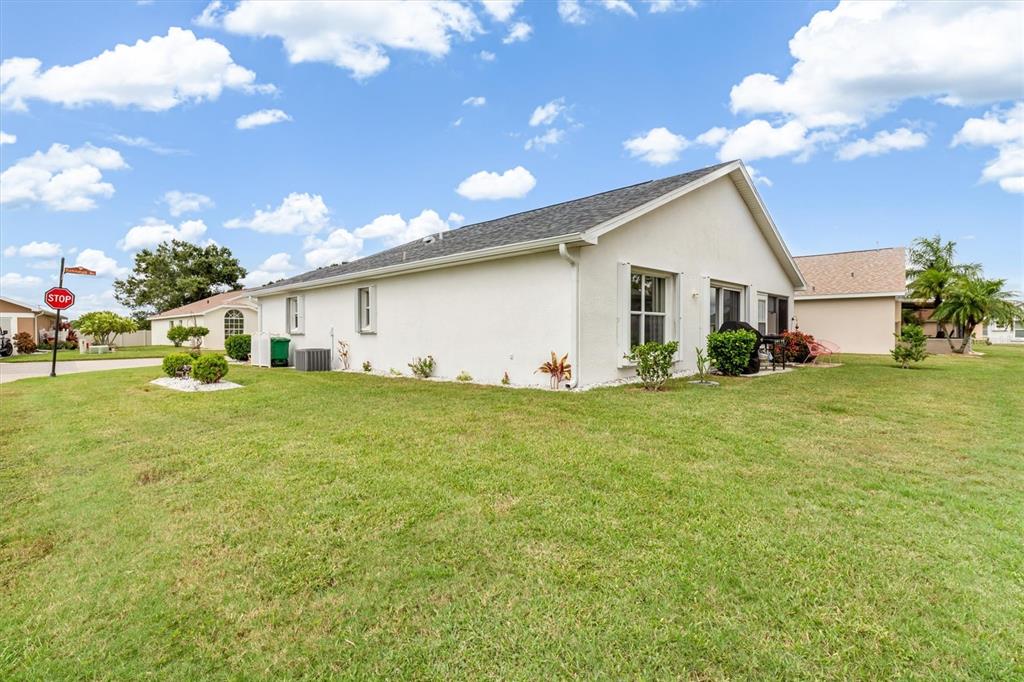 24167 Buckingham Way Punta Gorda, FL 33980 - Photo 26 of 42 a front view of house with garden
