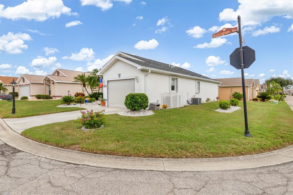 24167 Buckingham Way Punta Gorda, FL 33980 - Photo 28 of 42 a view of a house with a backyard porch and sitting area