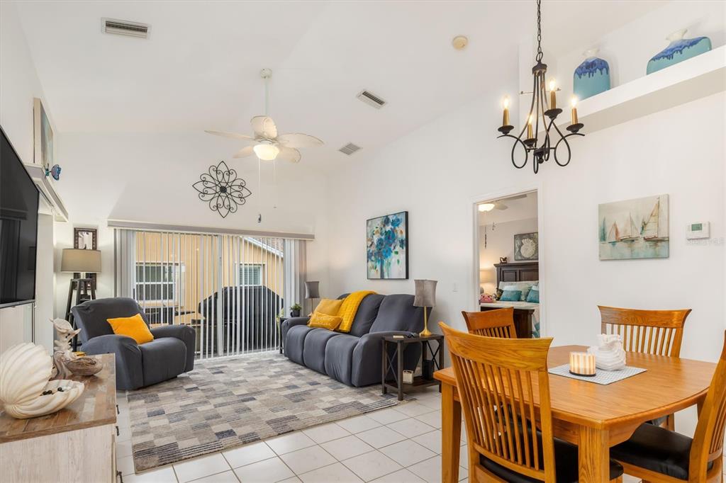 24167 Buckingham Way Punta Gorda, FL 33980 - Photo 4 of 42 a bedroom with furniture and a chandelier