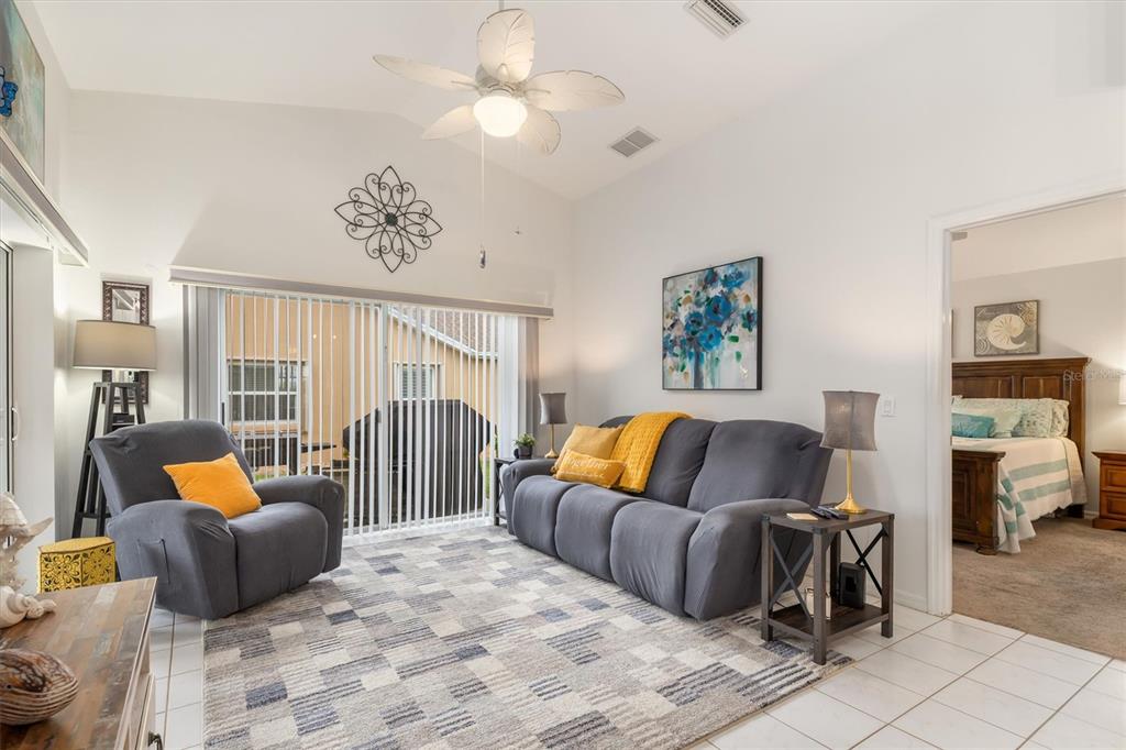 24167 Buckingham Way Punta Gorda, FL 33980 - Photo 5 of 42 a bedroom with furniture and large windows