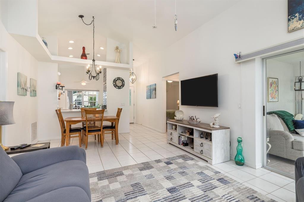 24167 Buckingham Way Punta Gorda, FL 33980 - Photo 8 of 42 a living room with furniture and a flat screen tv