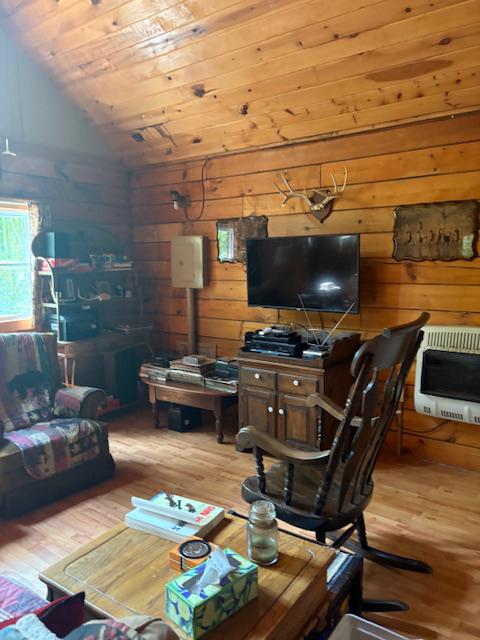 557 11 Road Clarence, PA 16829 - Photo 11 of 22 Living area with propane heater