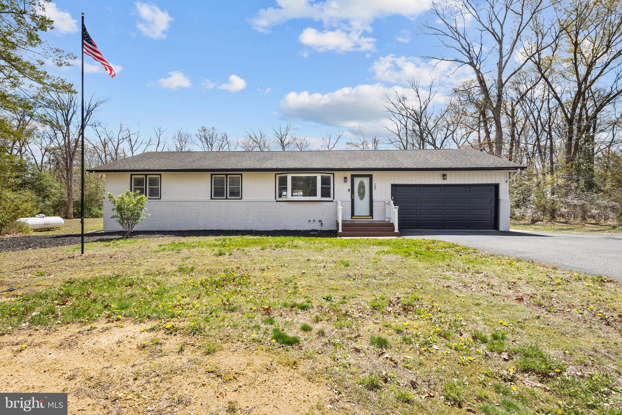 153 Crystal Road Elmer, NJ 08318 - Photo 1 of 29 a front view of a house with a garden