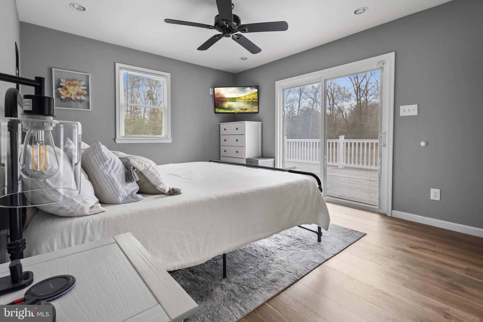 153 Crystal Road Elmer, NJ 08318 - Photo 13 of 29 a bedroom with a bed and wooden floor