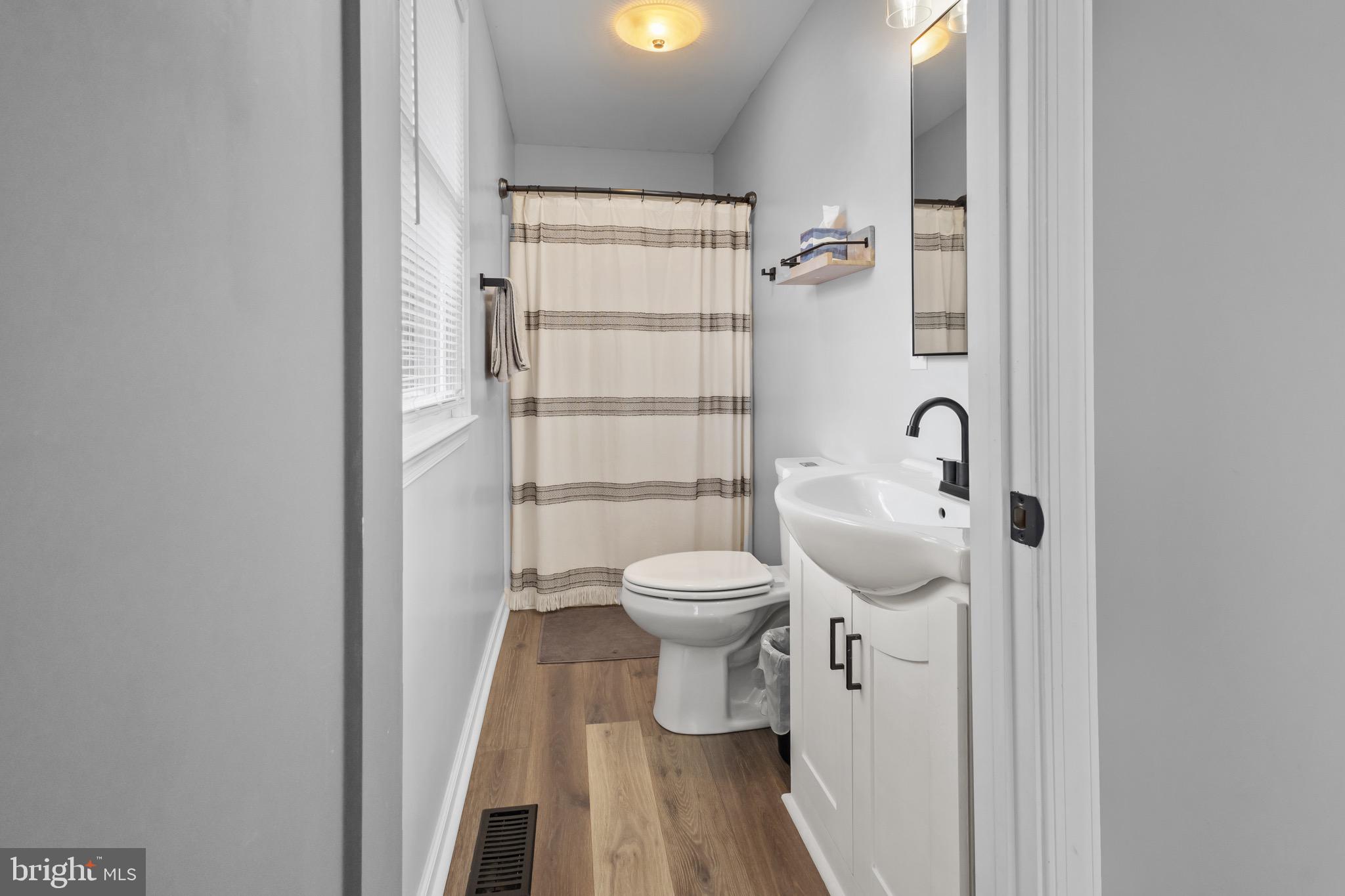 153 Crystal Road Elmer, NJ 08318 - Photo 15 of 29 a bathroom with a toilet sink and shower