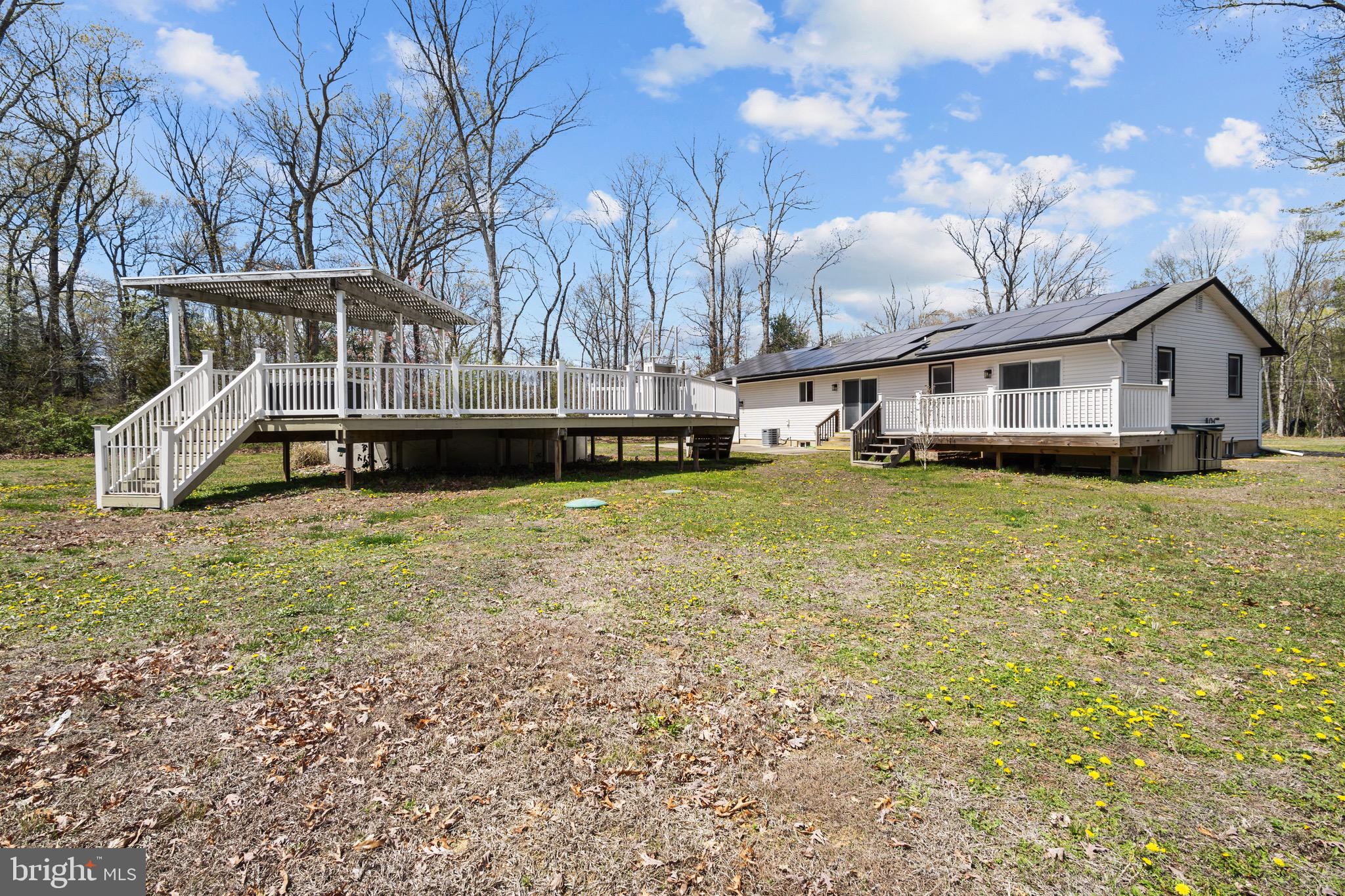 153 Crystal Road Elmer, NJ 08318 - Photo 29 of 29 a view of a house with a big yard and large trees