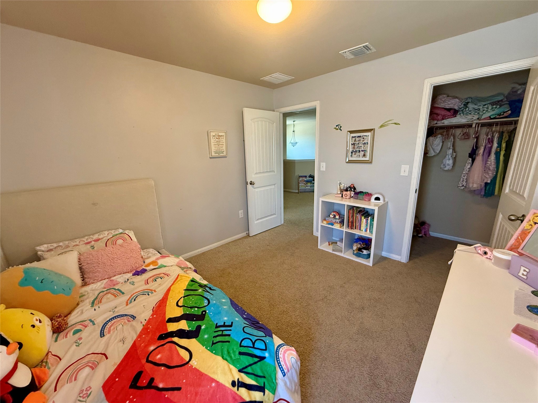 11700 Andesite Road Manor, TX 78653 - Photo 23 of 32 A well-proportioned room with warm carpeted flooring and practical closet storage.