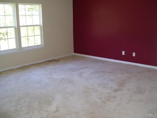 5701 Running Fox Lane Raleigh, NC 27703 - Photo 7 of 9 an empty room with a window