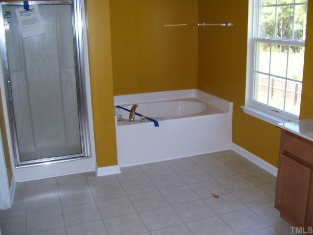 5701 Running Fox Lane Raleigh, NC 27703 - Photo 8 of 9 a view of a bathroom with a tub