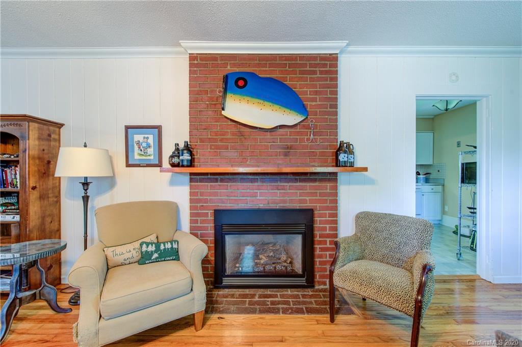 173 Callahan Street Rutherfordton, NC 28139 - Photo 11 of 25 a living room with furniture and a fireplace