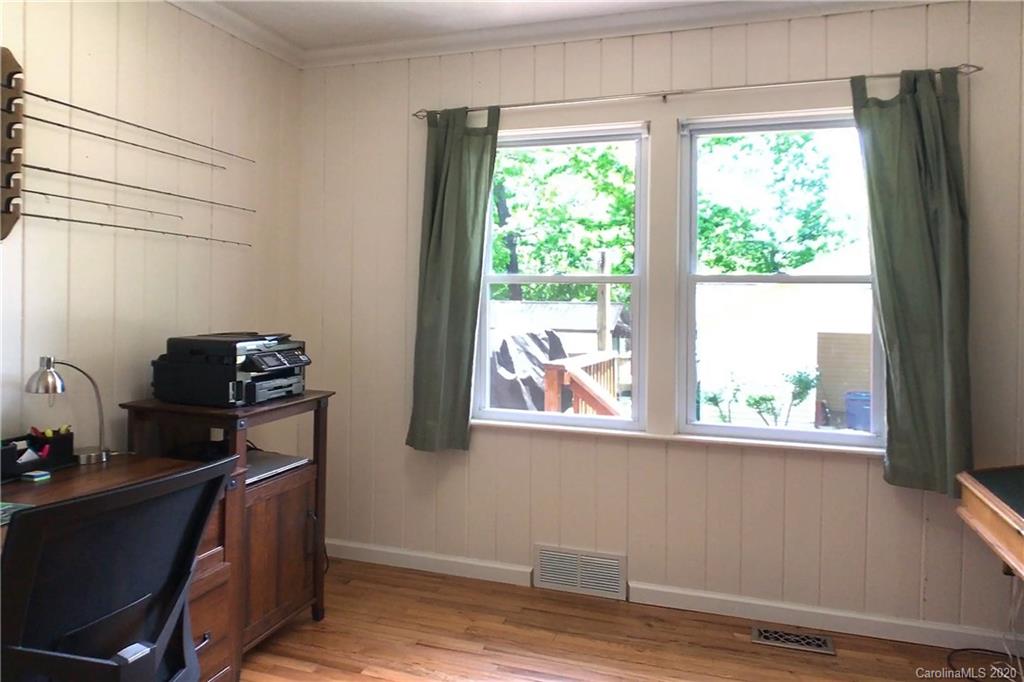 173 Callahan Street Rutherfordton, NC 28139 - Photo 17 of 25 a view of a workspace with furniture and a window