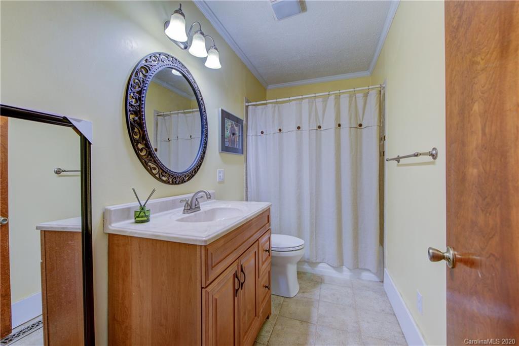 173 Callahan Street Rutherfordton, NC 28139 - Photo 18 of 25 a bathroom with a sink and a mirror