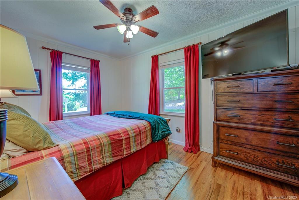 173 Callahan Street Rutherfordton, NC 28139 - Photo 19 of 25 a bedroom with a bed and a flat screen tv
