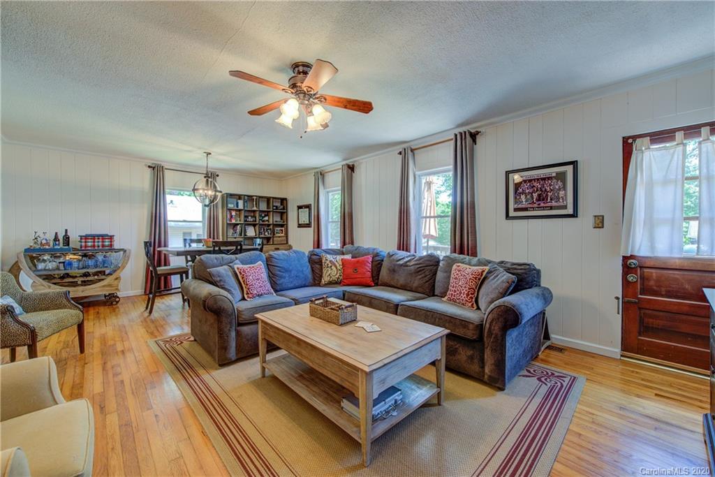 173 Callahan Street Rutherfordton, NC 28139 - Photo 9 of 25 a living room with furniture and a wooden floor