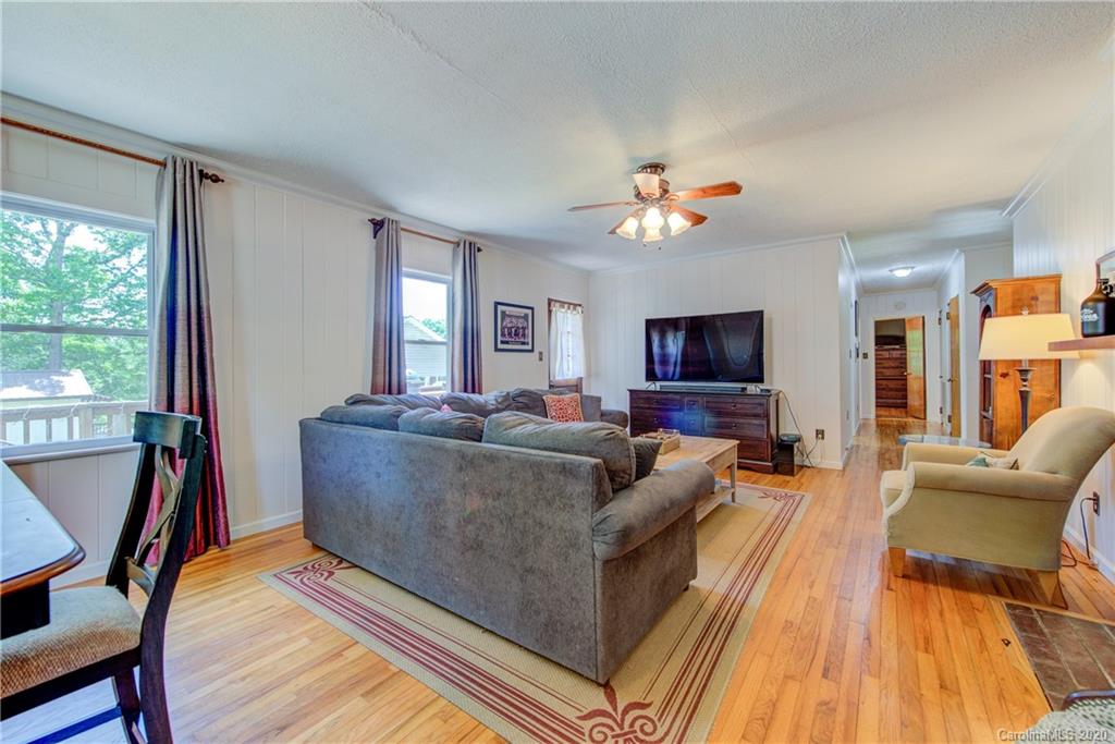 173 Callahan Street Rutherfordton, NC 28139 - Photo 10 of 25 a living room with furniture and a flat screen tv