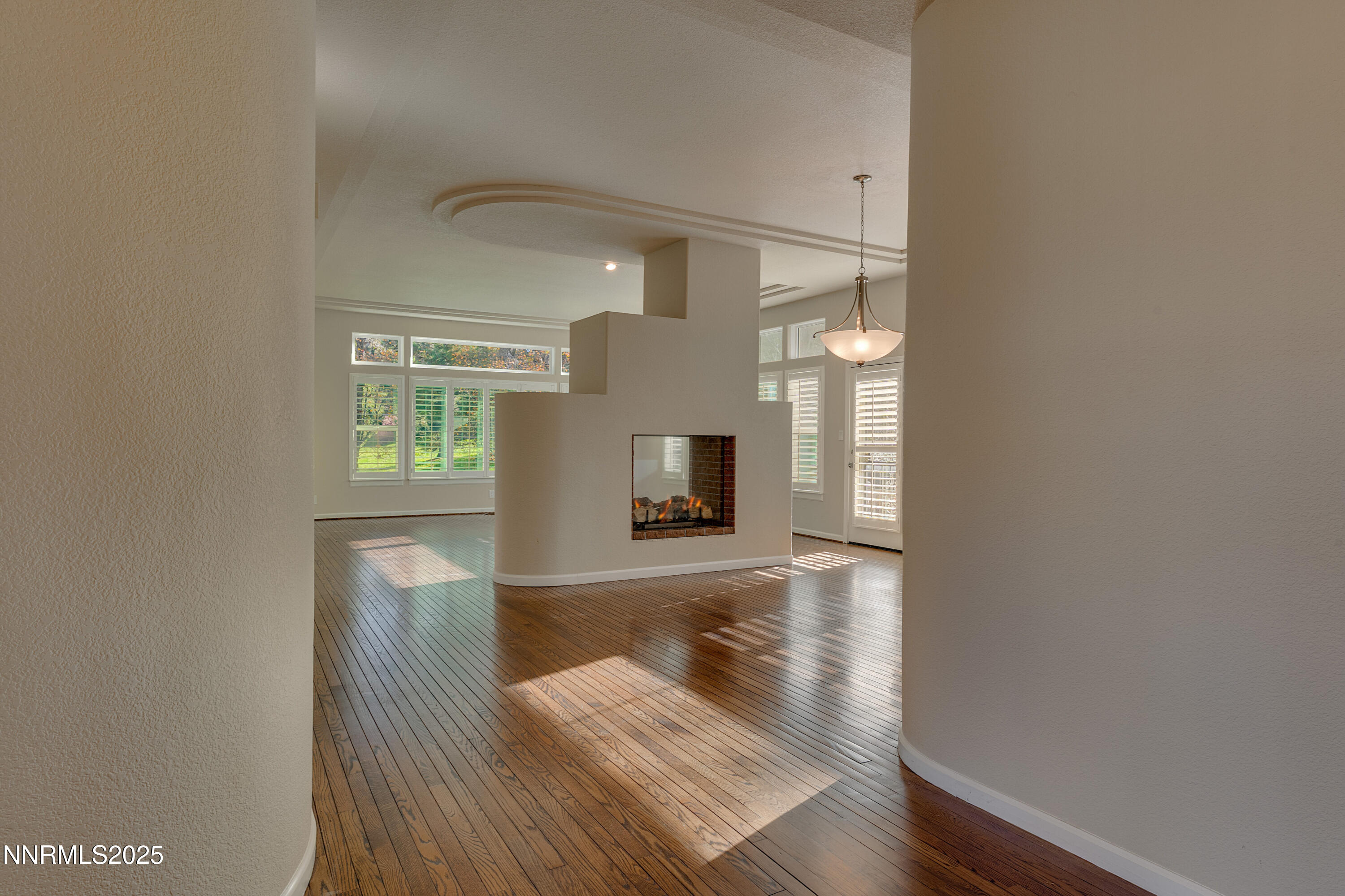 4052 Caughlin Creek Road Reno, NV 89519 - Photo 14 of 37 a view of a hallway with wooden floor and a bathroom