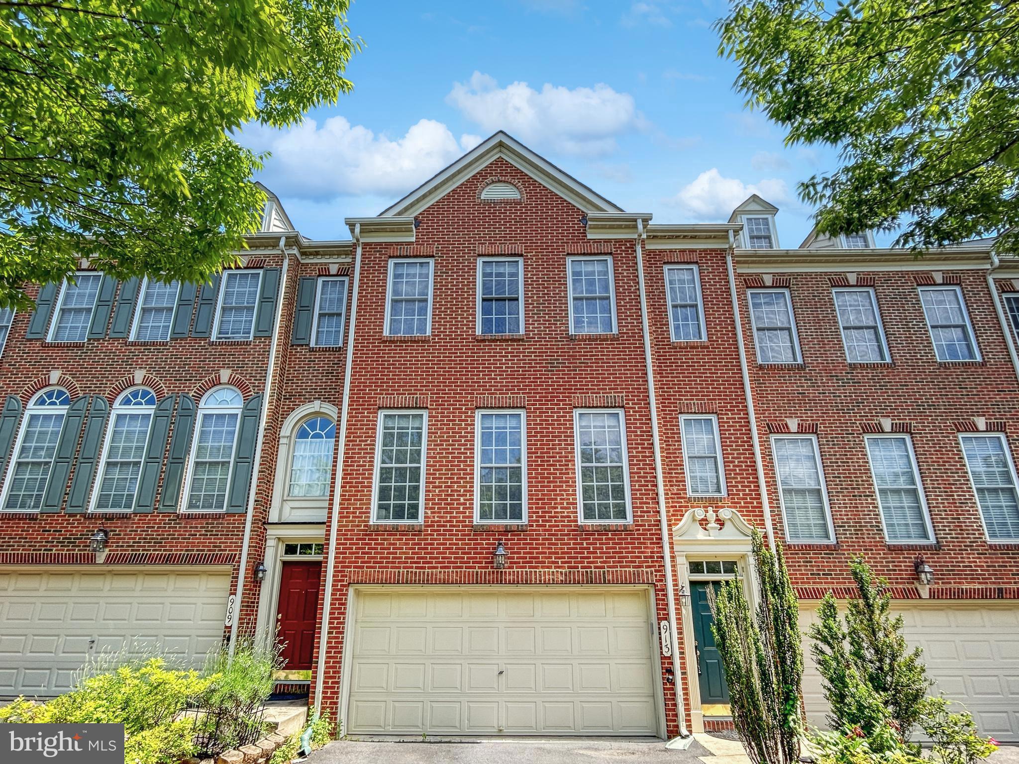 913 Highland Ridge Avenue Gaithersburg, MD 20878 - Photo 1 of 38 a front view of a house with garden