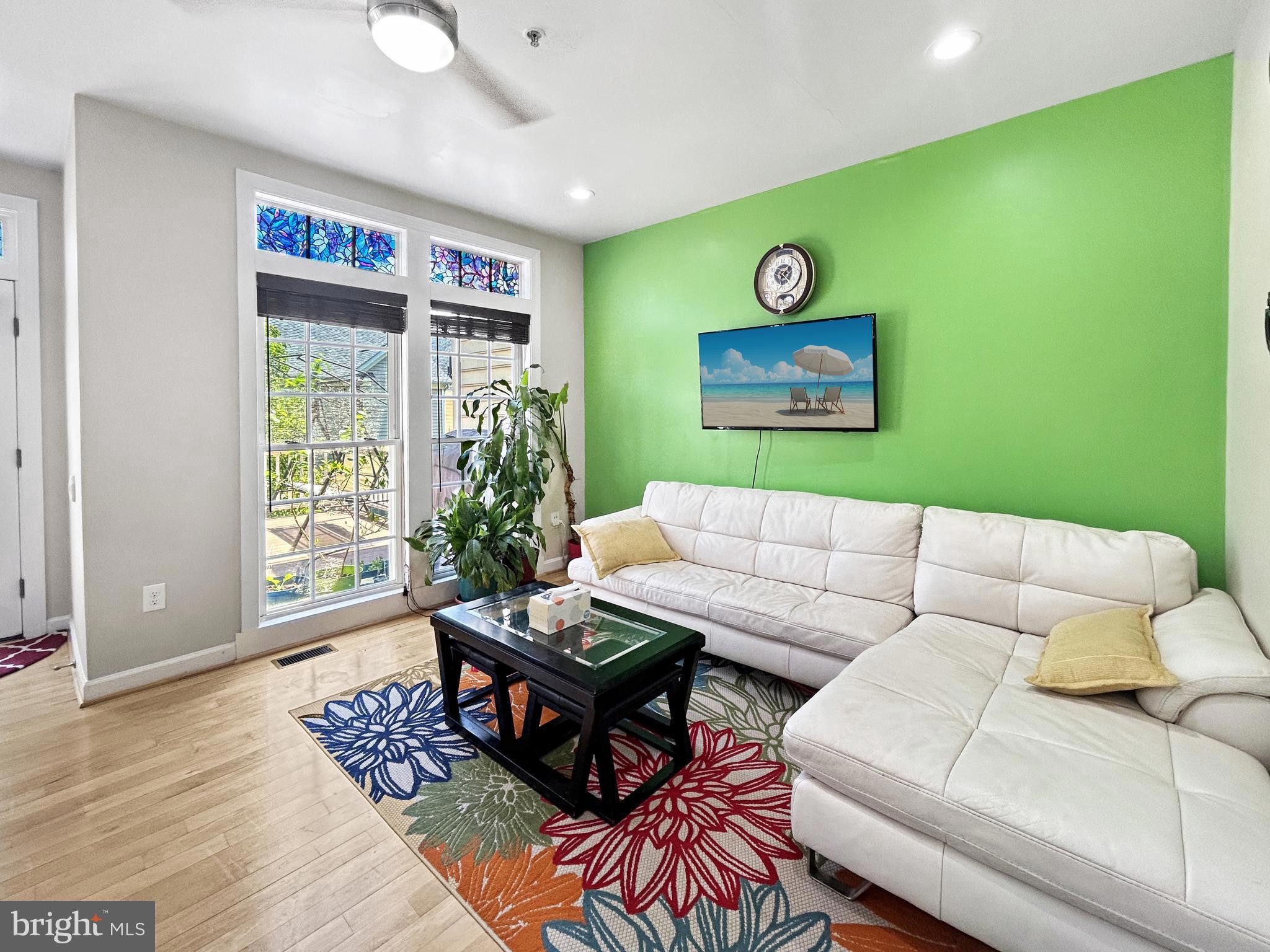 913 Highland Ridge Avenue Gaithersburg, MD 20878 - Photo 12 of 38 a living room with furniture and a large window